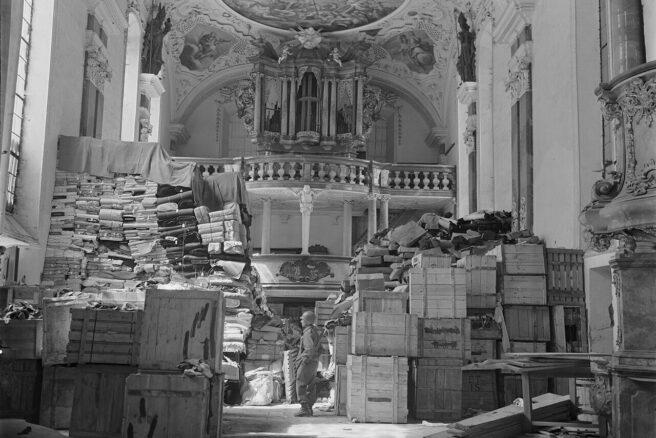 An American 3rd Army soldier inspects German loot stored, found at the Schloßkirche in the south German town Ellingen, April 24, 1945